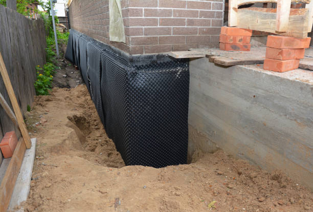 SJ Waterproofing Pros technician performing targeted Sump Pump Installation assessment in Hubbardston, MI